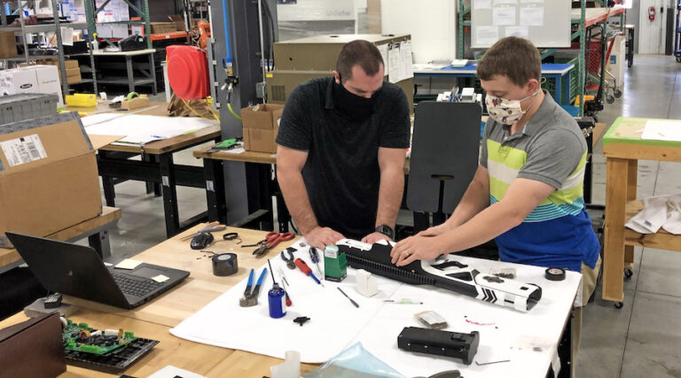 Two engineers look at the Shelby blaster