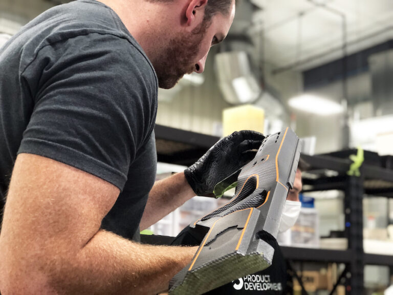 Man holds Shelby Destroyer prototype, low-angle
