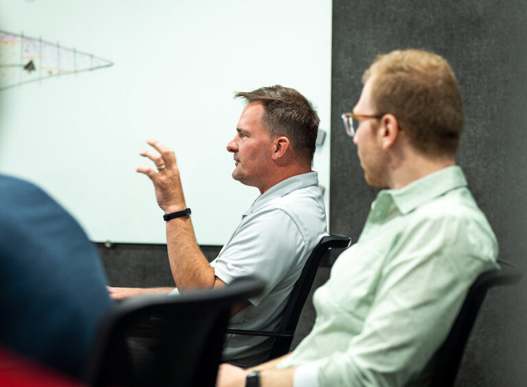 Man explaining an idea during a design meeting