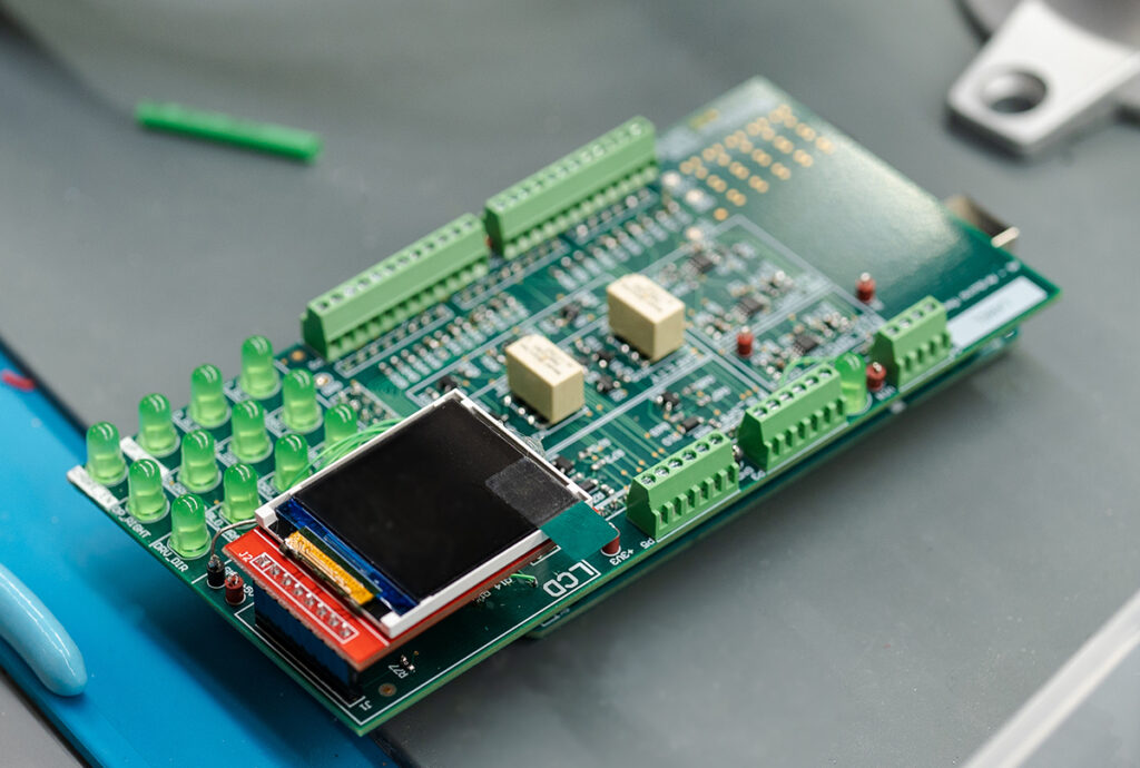 close up view of a PCB board with embedded display