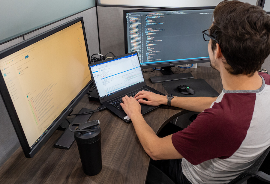 Software developer at his desk