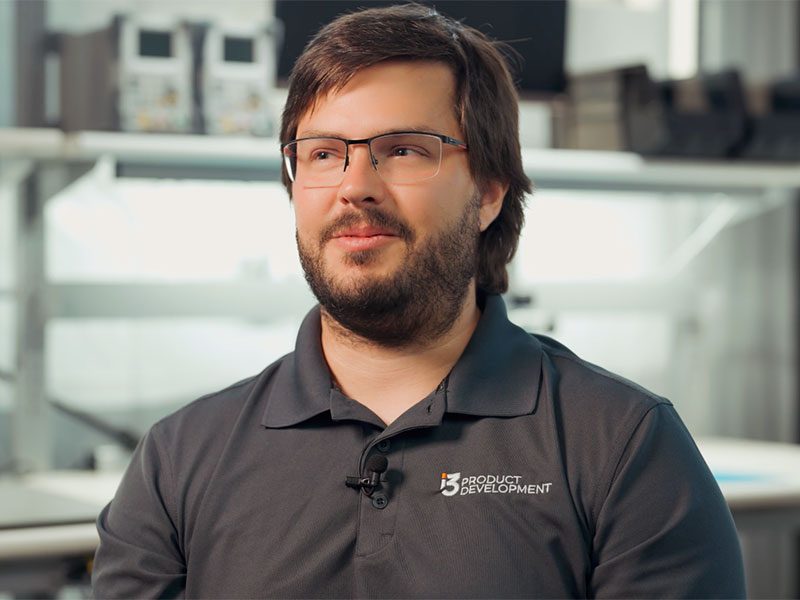 Male looking at the camera and talking about his job